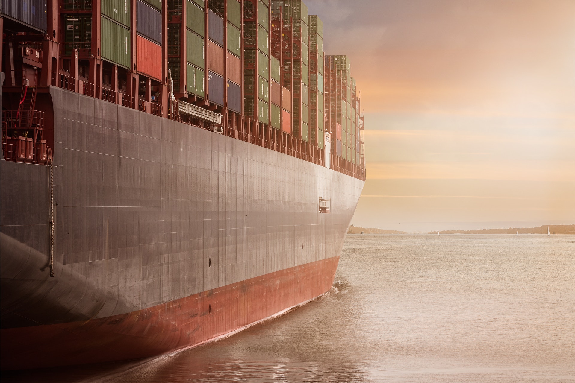 An image of a cargo ship carrying many containers