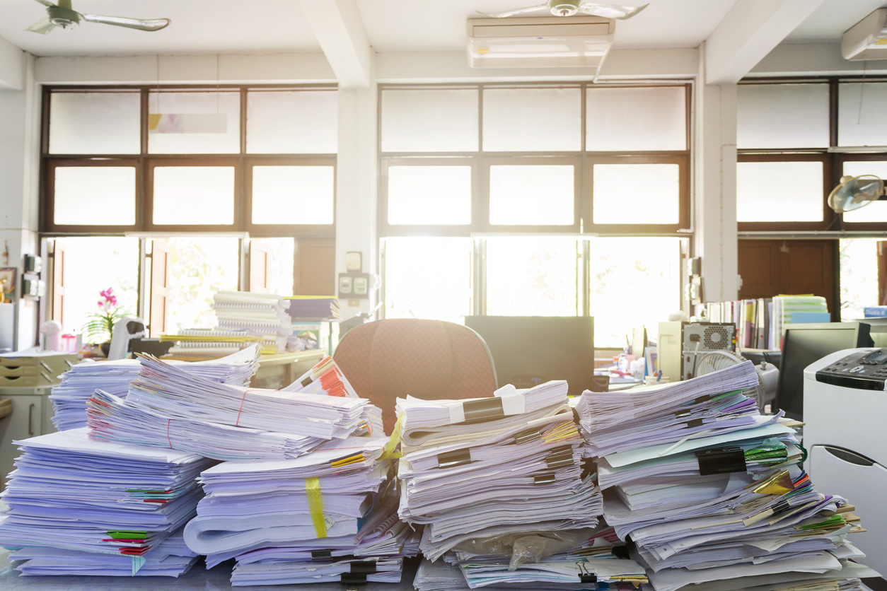 Pile of unfinished documents on office desk, Stack of business paper