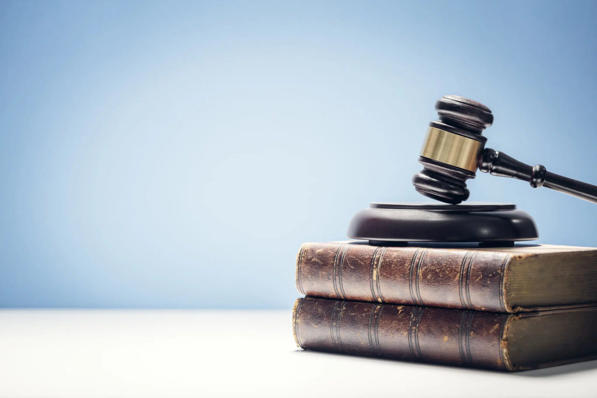 Judge gavel on top of a pile of books