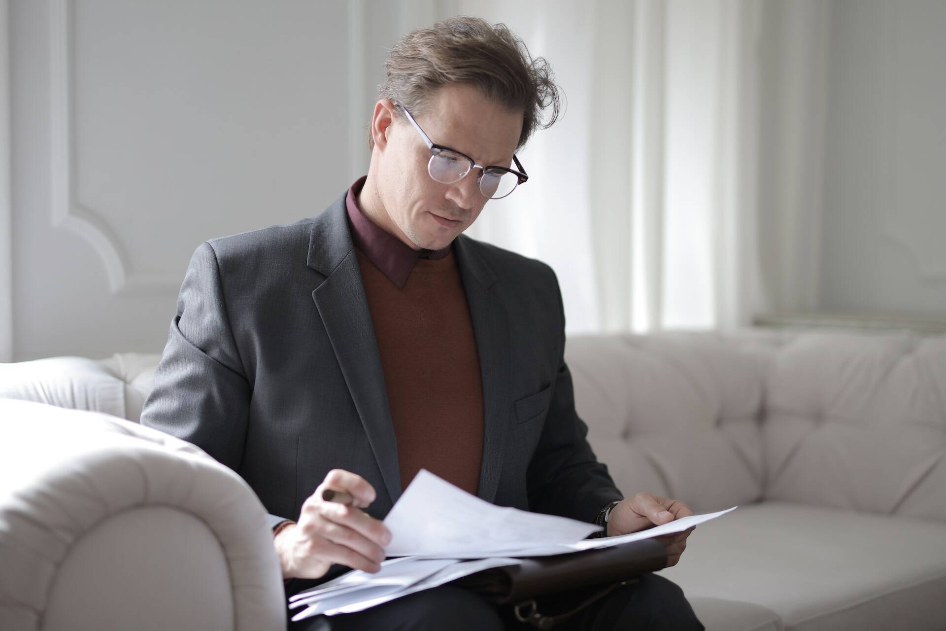 An image of a man looking through paperwork