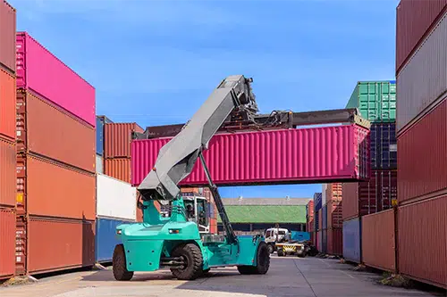 An image of a shipping dock with imported goods.