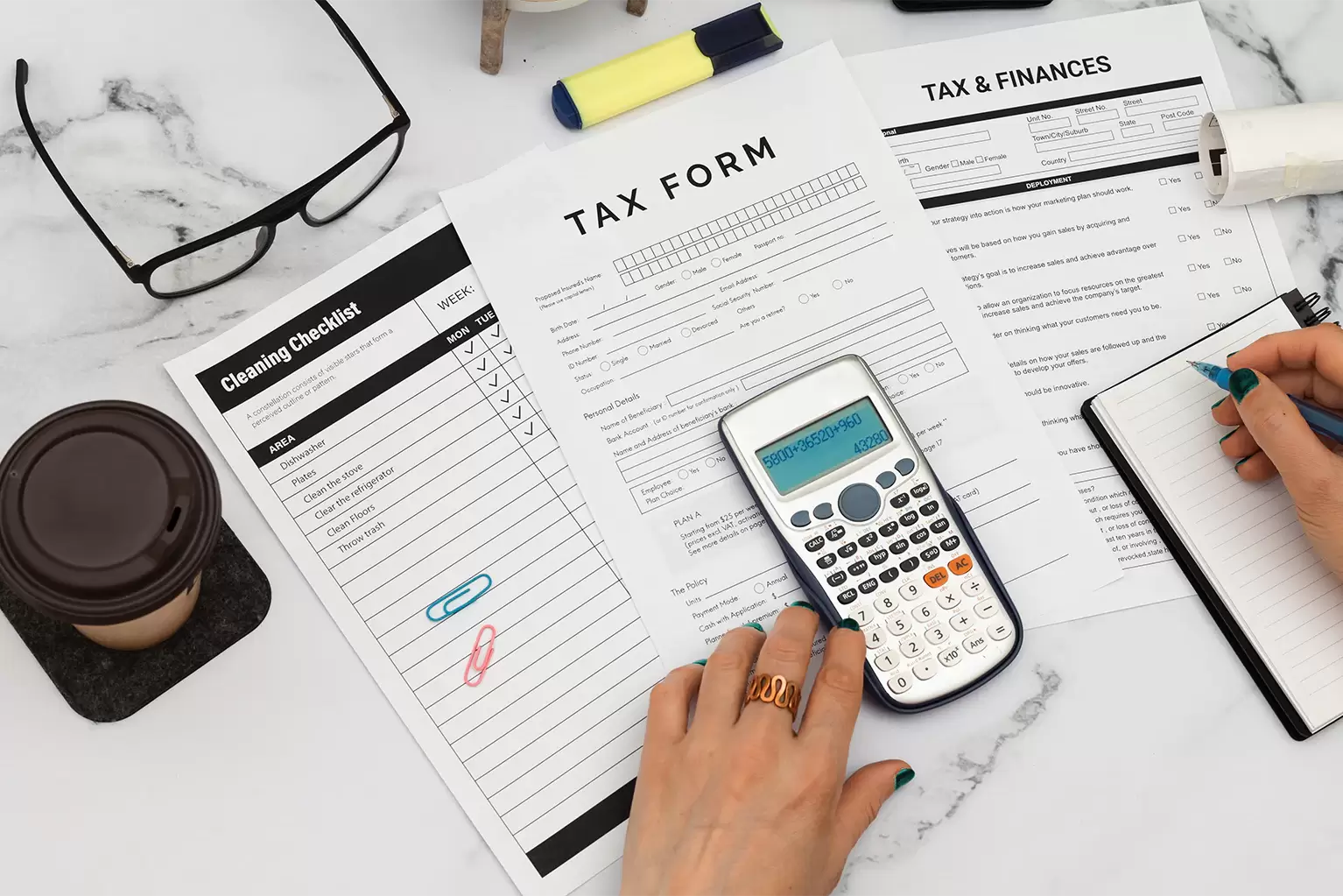 An image of a female processing tax form and finances