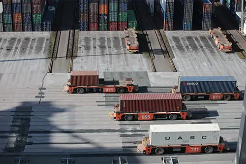 An image of lorries with shipping containers