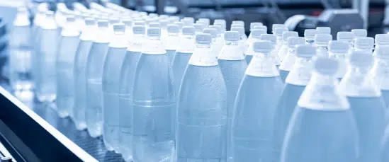 An image of water bottles on a production line