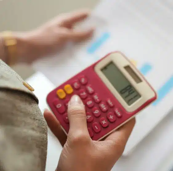 Person holding a calculator