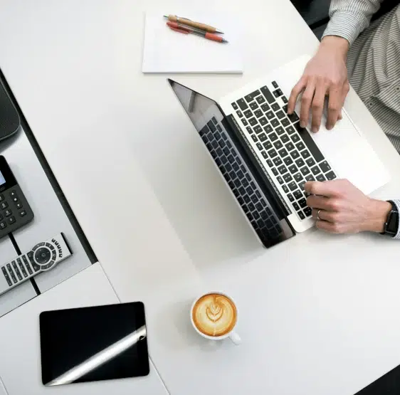 An image of a someone working on a laptop