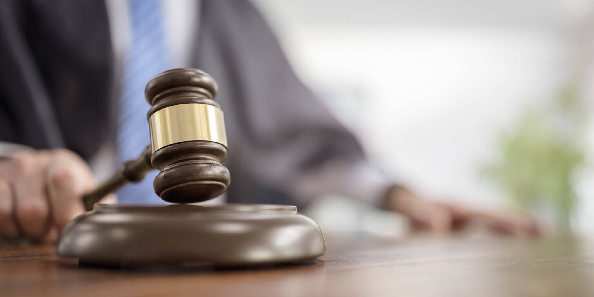 Judge holding gavel in court courtroom giving verdict