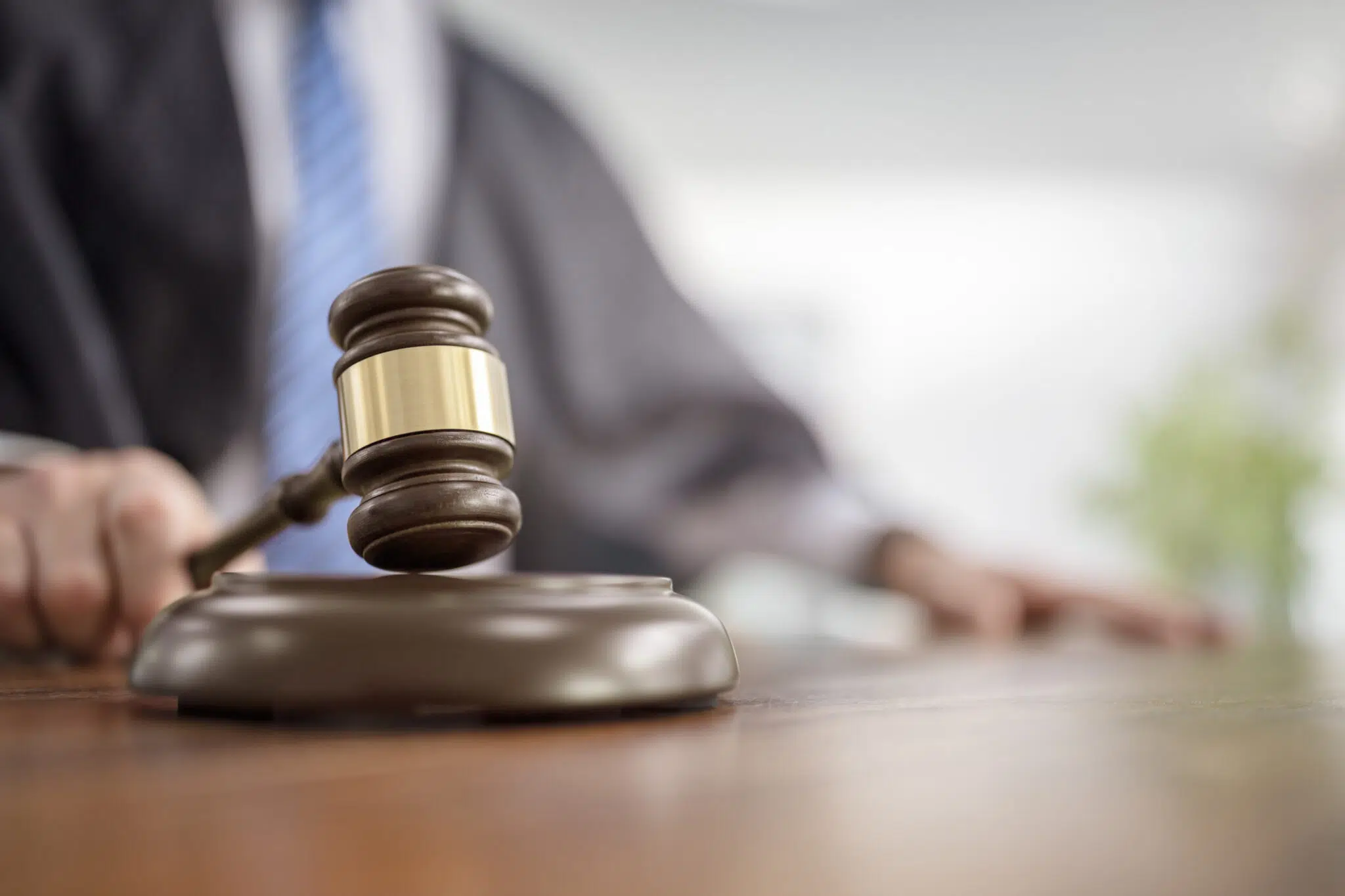 Judge holding gavel in court courtroom giving verdict